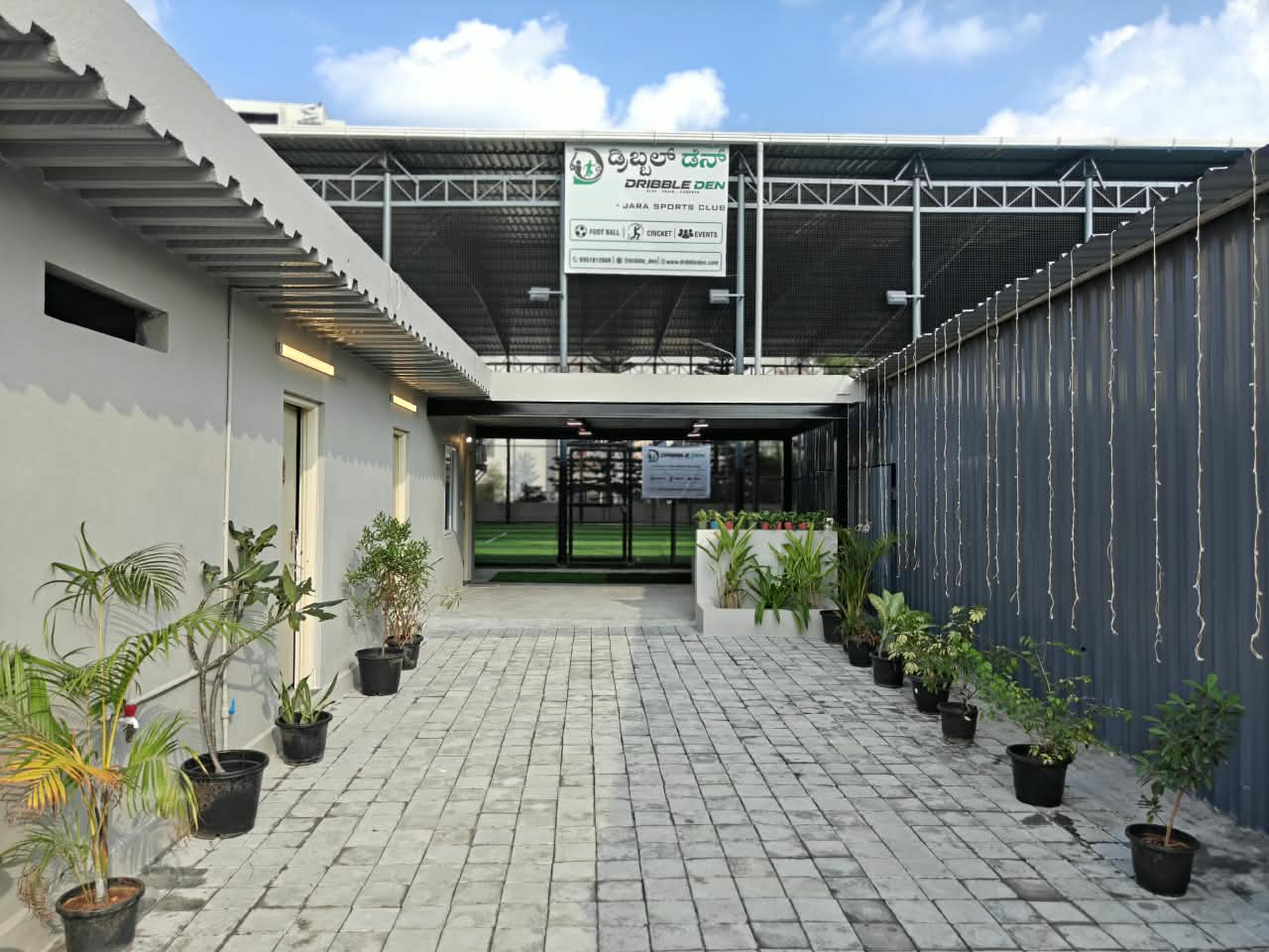 Dribble Den entrance walkway with the Jara Sports Club signboard